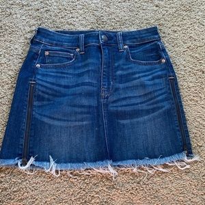 Lightly distressed denim skirt with side zippers